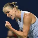 Elina Svitolina (UKR) reacts after playing a shot against Iga Swiatek (POL) during semi-final play at Sobeys Stadium.