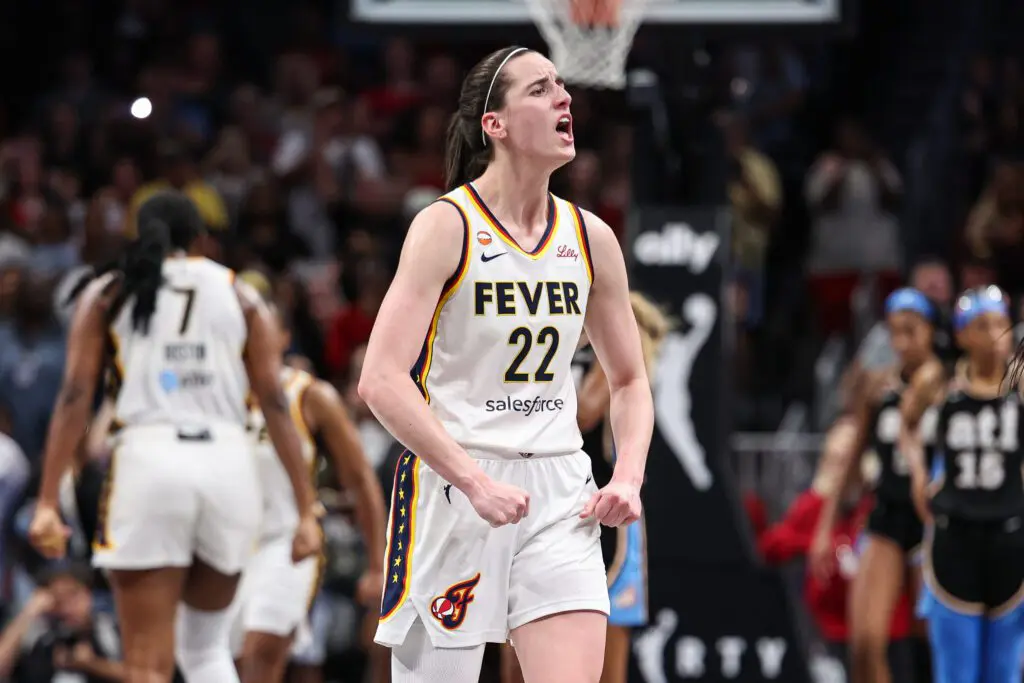 Indiana Fever guard Caitlin Clark (22) reacts against the Atlanta Dream during overtime at State Farm Arena.