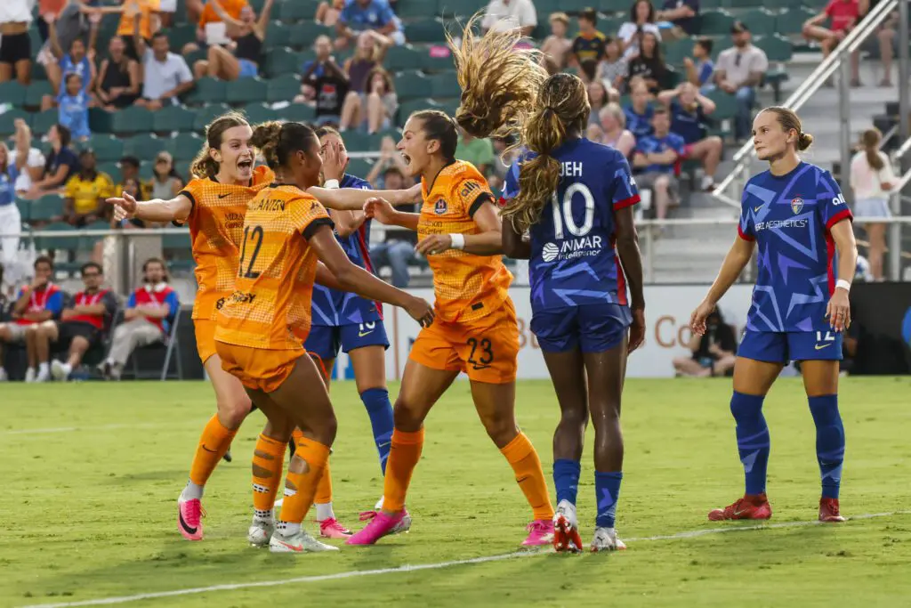 Houston Dash forward Kate Faasse (23) celebrates a goal with teammates during the first half against North Carolina Courage at First Horizon Stadium at WakeMed Soccer Park.