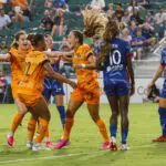 Houston Dash forward Kate Faasse (23) celebrates a goal with teammates during the first half against North Carolina Courage at First Horizon Stadium at WakeMed Soccer Park.