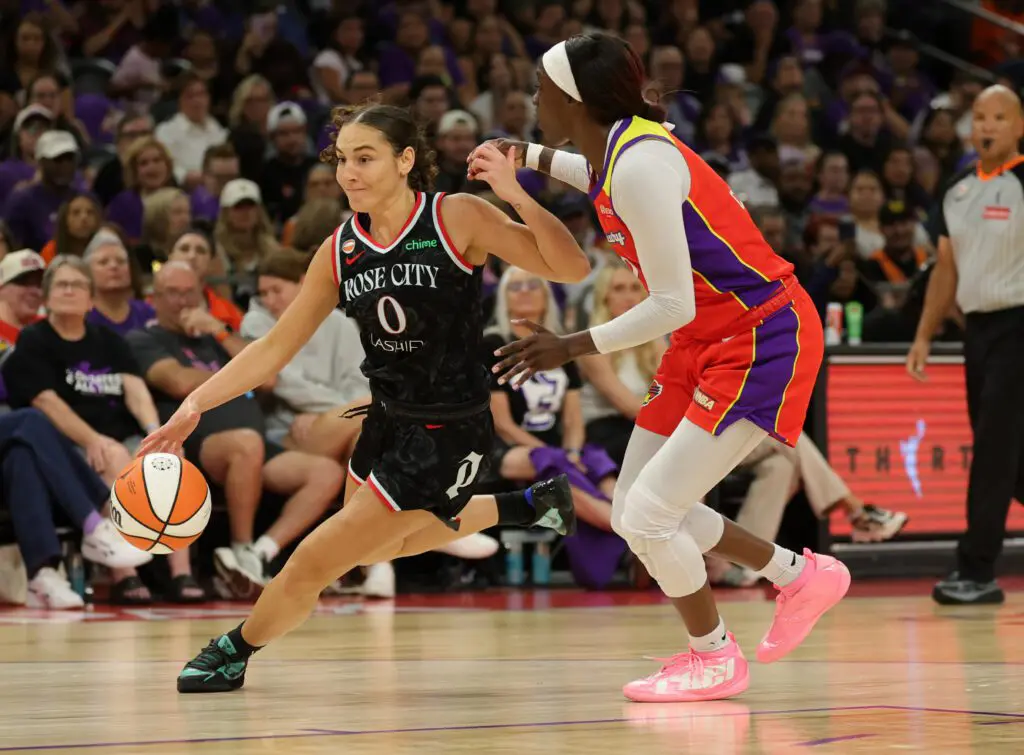 Portland Fire guard Carla Leite (0) drives to the basket against Phoenix Mercury guard Kahleah Copper in the second half at Mortgage Matchup Center.