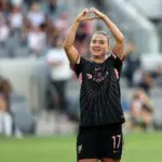 Angel City FC forward Ally Sentnor (17) celebrates after scoring a goal that was later disallowed following a video review for a handball during the first half against the Washington Spirit at BMO Stadium.