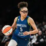 Minnesota Lynx guard Olivia Miles (5) brings the ball up court against the Dallas Wings at Target Center.