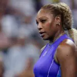 Serena Williams of the United States stands on the court against Marta Kostyuk of Ukraine and Peyton Stearns of the United States in their doubles match during the Cincinnati Open at Lindner Family Tennis Center.
