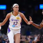 Los Angeles Sparks guard Rae Burrell (12) returns the ball against Connecticut Sun forward Diamond Miller (1) in the second half at TD Garden.