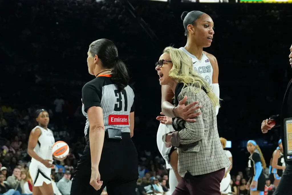 Las Vegas Aces center A'ja Wilson (22) holds back head coach Becky Hammon in the second quarter of the game against the Atlanta Dream at Michelob Ultra Arena.