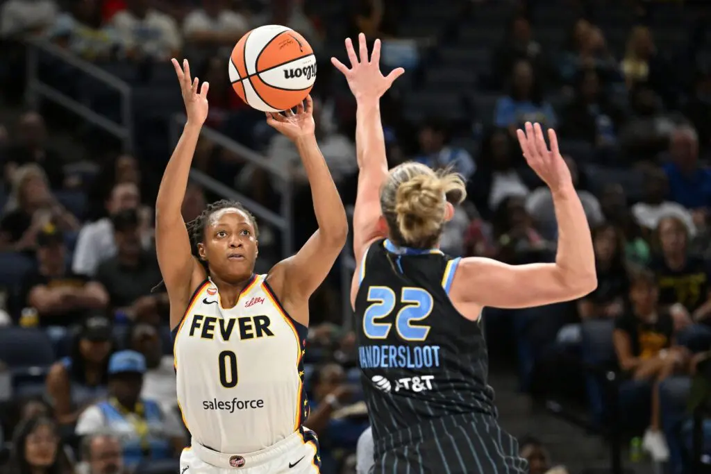 Indiana Fever guard Kelsey Mitchell (0) goes up for a shot against Chicago Sky guard Courtney Vandersloot (22) during the first half at Wintrust Arena.