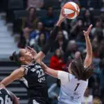 Las Vegas Aces center A'ja Wilson (22) blocks a shot taken by Toronto Tempo guard Kiki Rice (1) in the second half at Rogers Arena.
