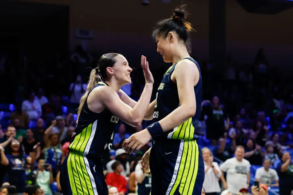Dallas Wings guard Paige Bueckers (5) reacts with center Li Yueru (28) after a play against the Portland Fire during the second half at College Park Center.