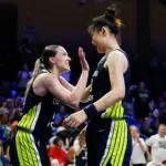 Dallas Wings guard Paige Bueckers (5) reacts with center Li Yueru (28) after a play against the Portland Fire during the second half at College Park Center.