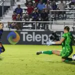 North Carolina Courage midfielder Ashley Sanchez (2) scores a goal past Angel City FC goalkeeper Angelina Anderson (19) during the second half at First Horizon Stadium at WakeMed Soccer Park.