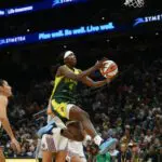Seattle Storm guard Flau'jae Johnson (4) shoots a layup against the Toronto Tempo during the first half at Climate Pledge Arena.