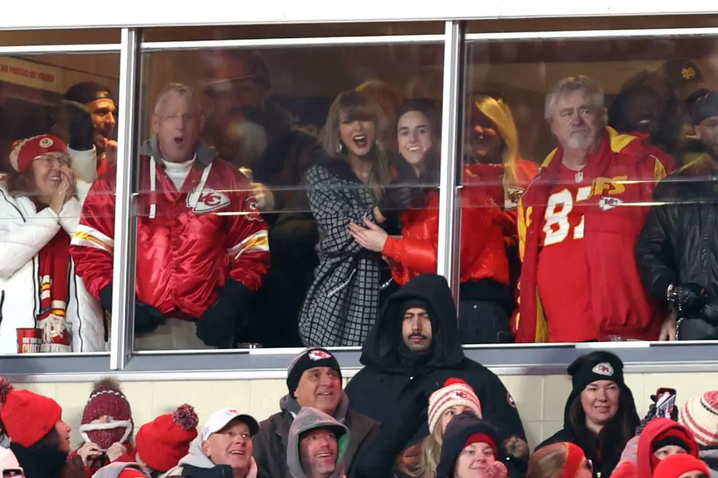 Taylor Swift and Caitlin Clark celebrate during an NFL football game between the Houston Texans and Kansas City Chiefs at GEHA Field at Arrowhead Stadium on January 18, 2025 in Kansas City, Missouri.