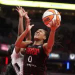 Kelsey Mitchell #0 of the Indiana Fever shoots the ball during the game against the Las Vegas Aces in Game Three of the semifinals of the 2025 WNBA Playoffs at Gainbridge Fieldhouse on September 26, 2025 in Indianapolis, Indiana.