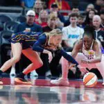 Indiana Fever guard Sophie Cunningham (8) battles for a loose ball with Los Angeles Sparks forward Nneka Ogwumike (30) on June 27, 2026, at Gainbridge Fieldhouse in Indianapolis, Indiana.