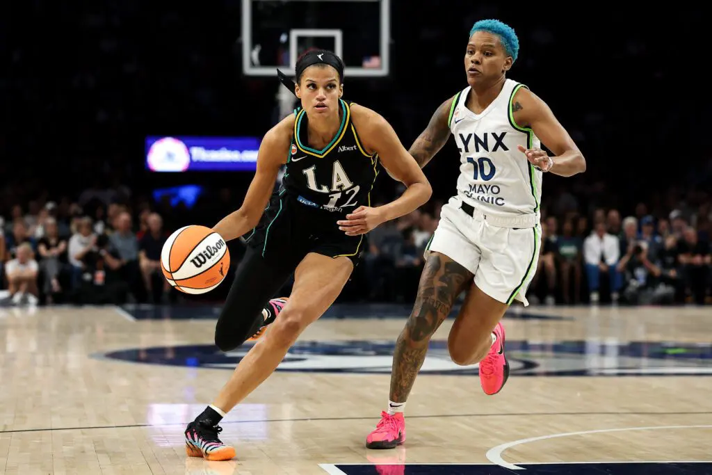 Rae Burrell #12 of the Los Angeles Sparks works around Courtney Williams #10 of the Minnesota Lynx during the first half at Target Center on August 6, 2026 in Minneapolis, Minnesota.