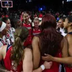 Shakira Austin #0 of the Washington Mystics huddles with teammates after the game against the Phoenix Mercury at CareFirst Arena on August 9, 2026 in Washington, DC.
