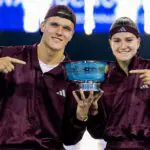 Jakub Mensik of the Czech Republic and Karolina Muchova of the Czech Republic pose with the champions trophy after defeating Belinda Bencic of Switzerland and Flavio Cobolli of Italy in the Mixed Doubles final of the US Open at USTA Billie Jean King National Tennis Center on August 26, 2026 in New York City.