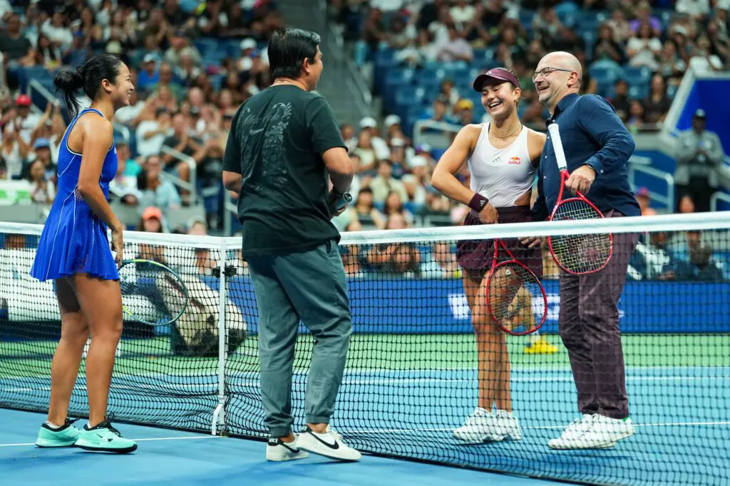 Alexandra Eala's father, Michael Eala, and Alexandra Eala with Iva Jovic and Iva Jovic's father, Bojan Jovic, on court during a Stars of the Open match against Alexandra Eala during Fan Week as part of the 2026 US Open at USTA Billie Jean King National Tennis Center on Thursday.