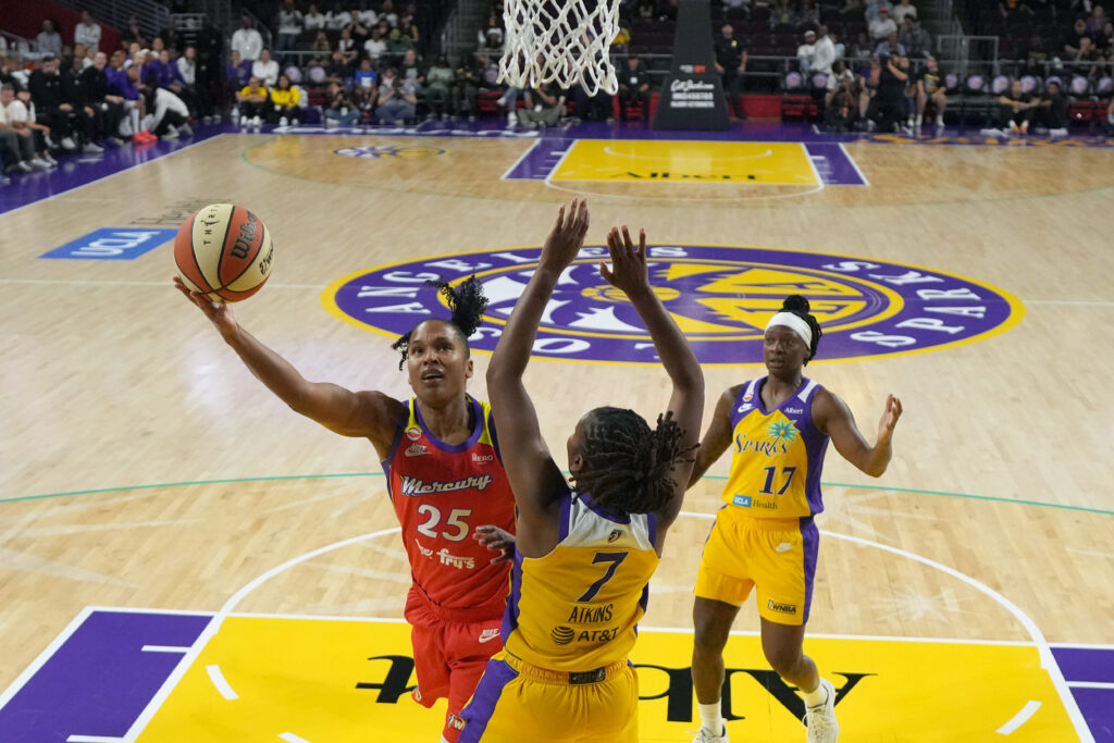 Phoenix Mercury forward Alyssa Thomas (25) shoots the ball against LA Sparks guard Ariel Atkins (7) in the first half at the Galen Center. Mandatory
