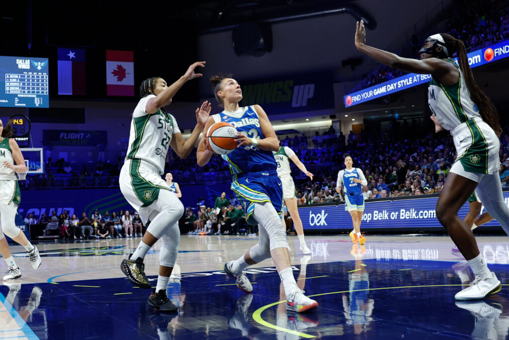 Dallas Wings forward Jessica Shepard (32) drives to the basket ahead of Seattle Storm guard Taina Mair (22) during the first half at College Park Center.