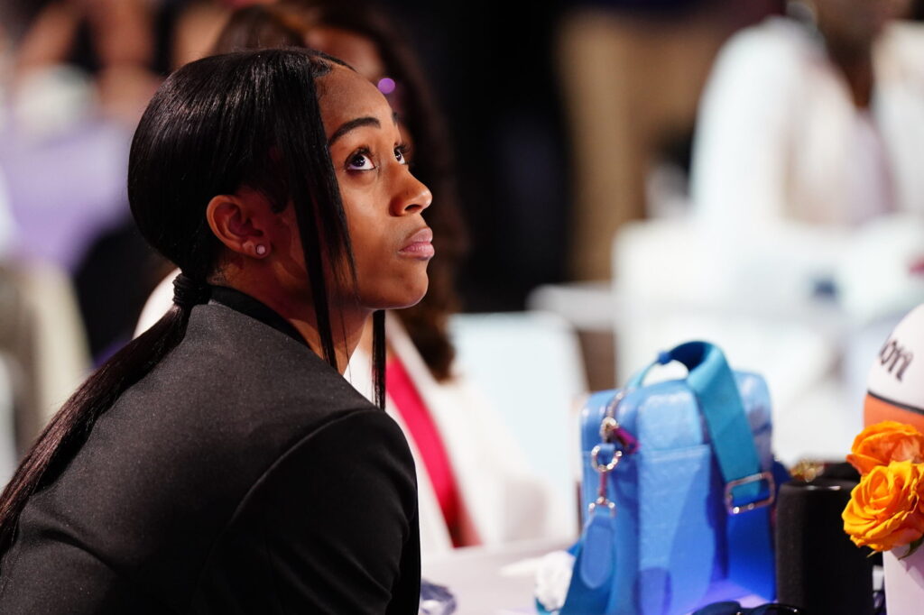 Alexis Morris waits for her name to be called during the 2023 WNBA Draft.