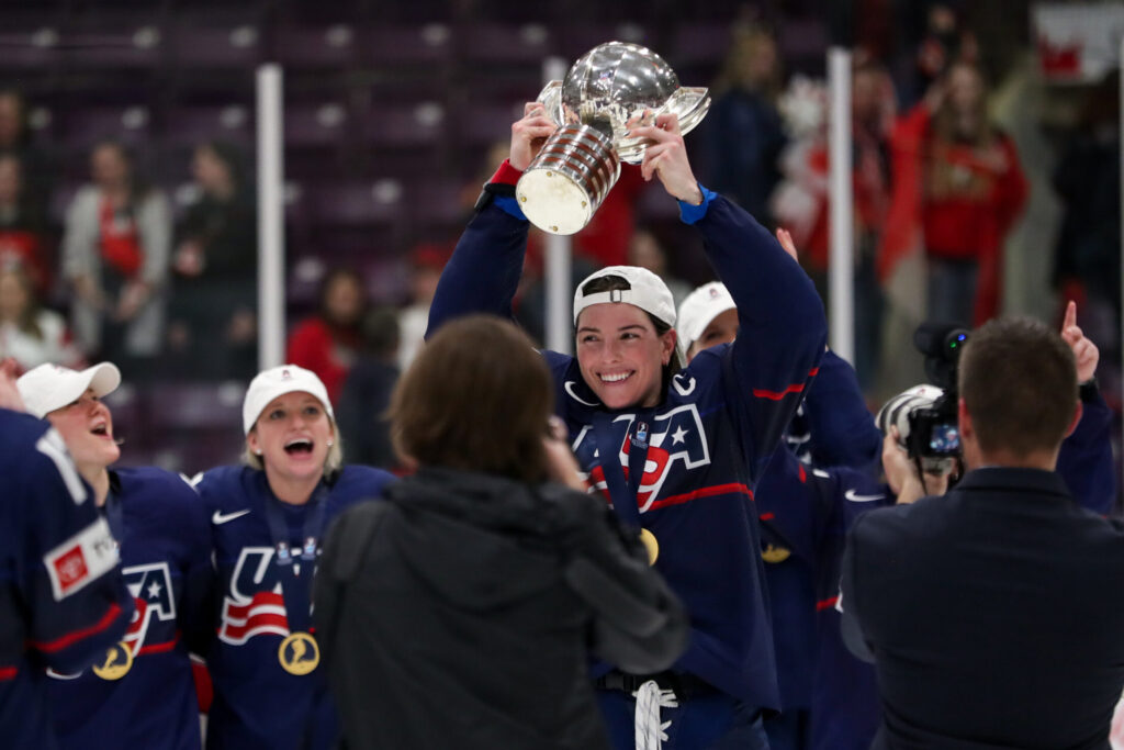 Hilary Knight lifts the trophy after the U.S. women's hockey team defeated Canada, 6-3, at the 2023 IIHF Women's World Championship.