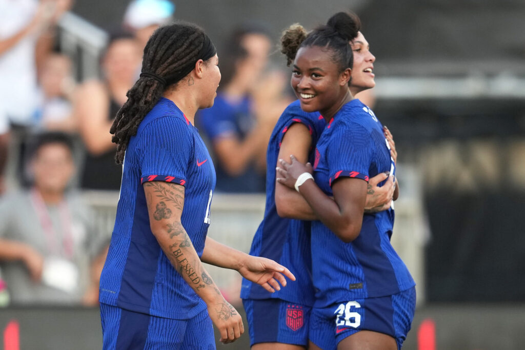 Trinity Rodman of the United States celebrates scoring with Jaedyn Shaw and Mia Fishel during the second half of an international friendly against China PR at DRV PNK Stadium on December 02, 2023. (Brad Smith/ISI Photos/USSF/Getty Images for USSF)