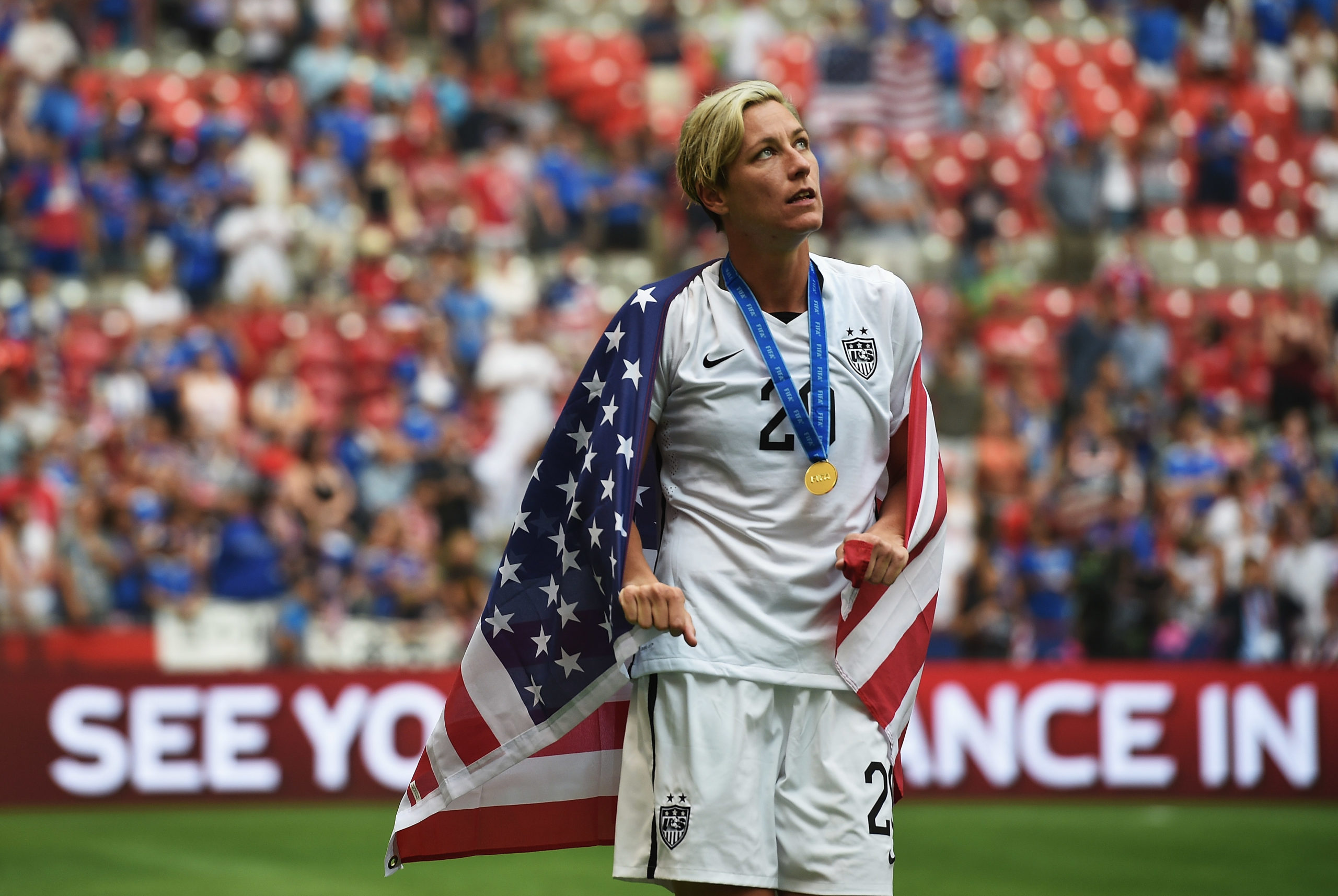 Abby Wambach congratulates Christine Sinclair and Canada on