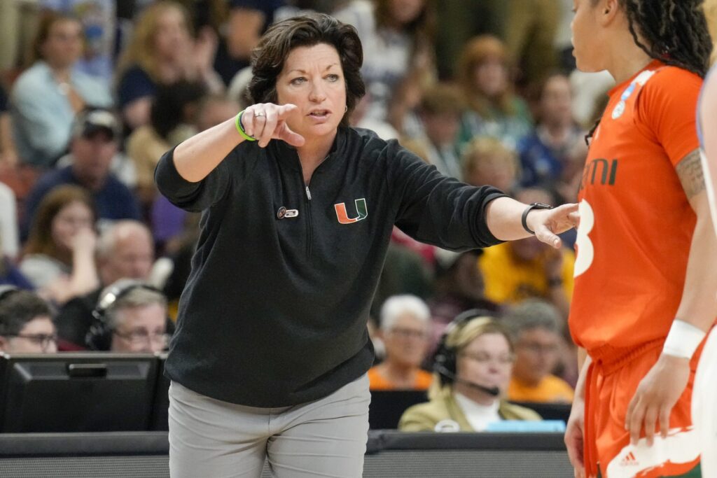 Miami Hurricanes head coach Katie Meier talks to a player during an NCAA women's basketball tournament game