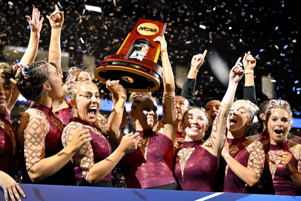 Oklahoma's women's gymnastics team celebrates winning the 2023 NCAA team title.