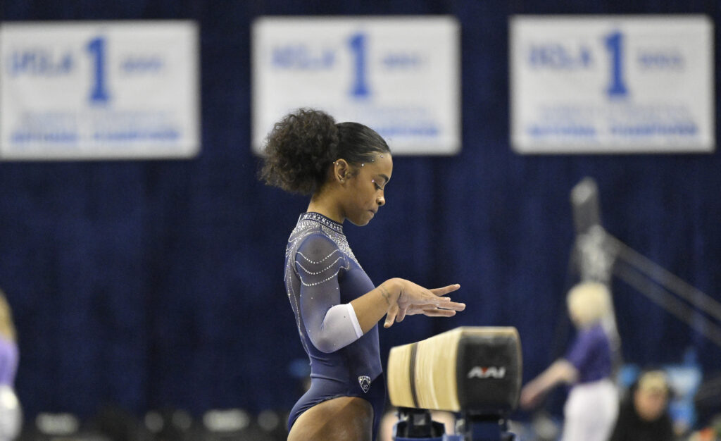 ncaa gymnast selena harris at the beam for ucla