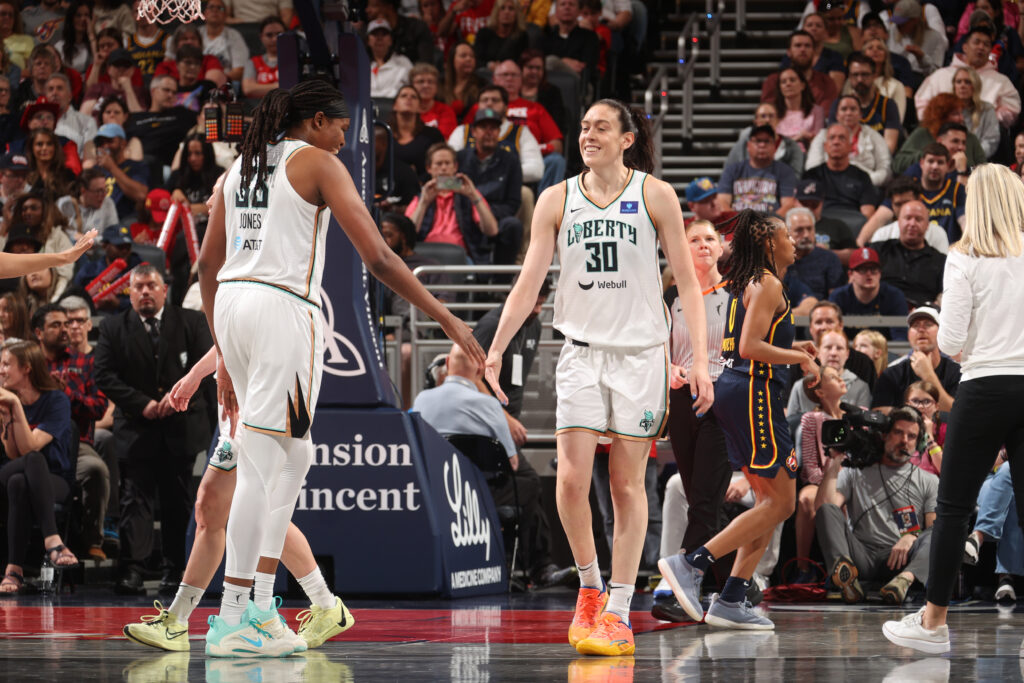 breanna stewart and jonquel jones of the new york liberty celebrate win over indiana fever