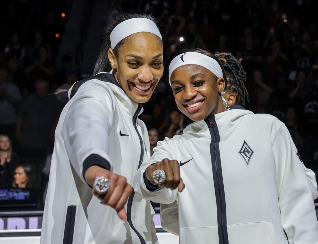 A'ja Wilson (L) #22 and Jackie Young #0 of the Las Vegas Aces pose with their 2023 WNBA championship rings