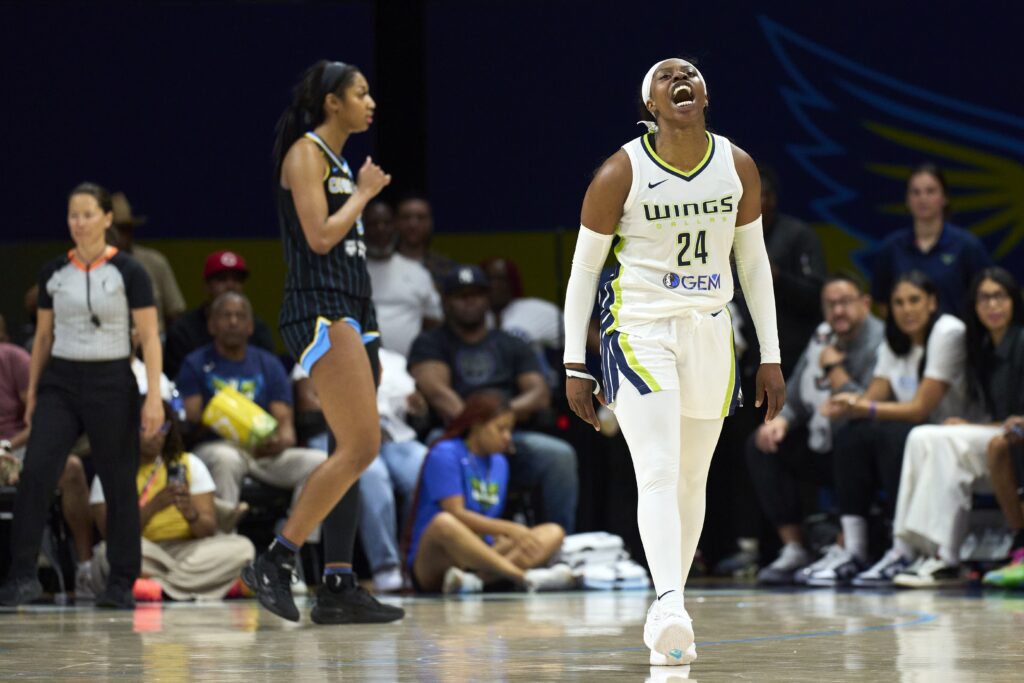 Arike Ogunbowale of the Dallas Wings celebrates after a play against the Chicago Sky