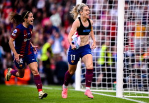 Barcelona's Aitana Bonmatí and Alexia Putellas celebrating after beating Lyon at the 2024 Champions League final