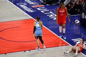 caitlin clark of the indiana fever after getting fouled by the sky's chennedy carter