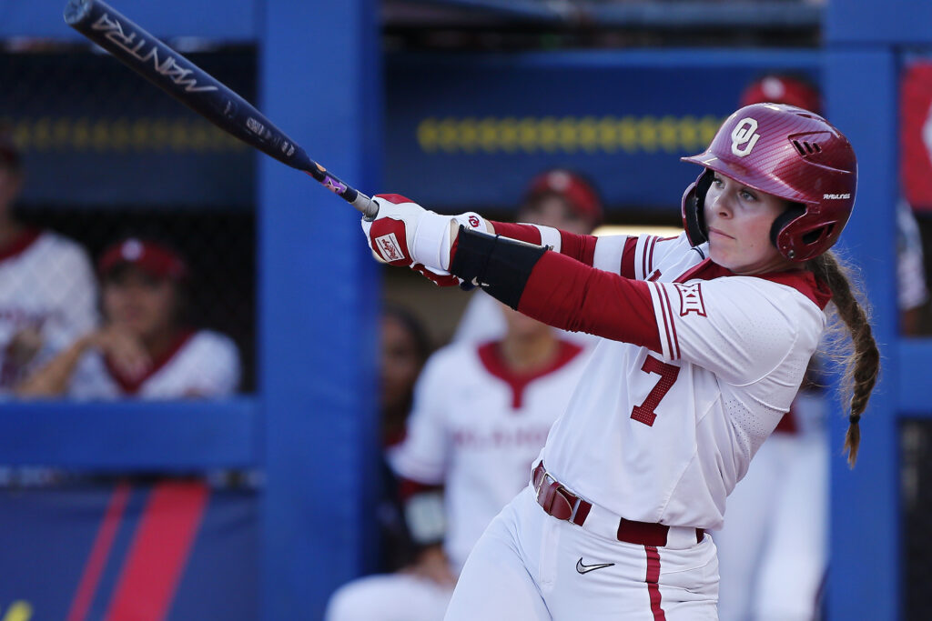 Kasidi Pickering #7 of the Oklahoma Sooners follows through on a solo home run against the Texas Longhorns in the third inning during the Championship Finals of the 2024 NCAA WCWS