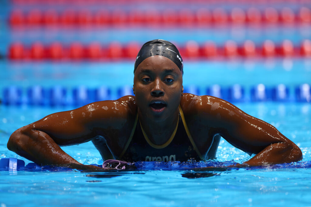 us olympic swimming team's simone manuel rests in a pool