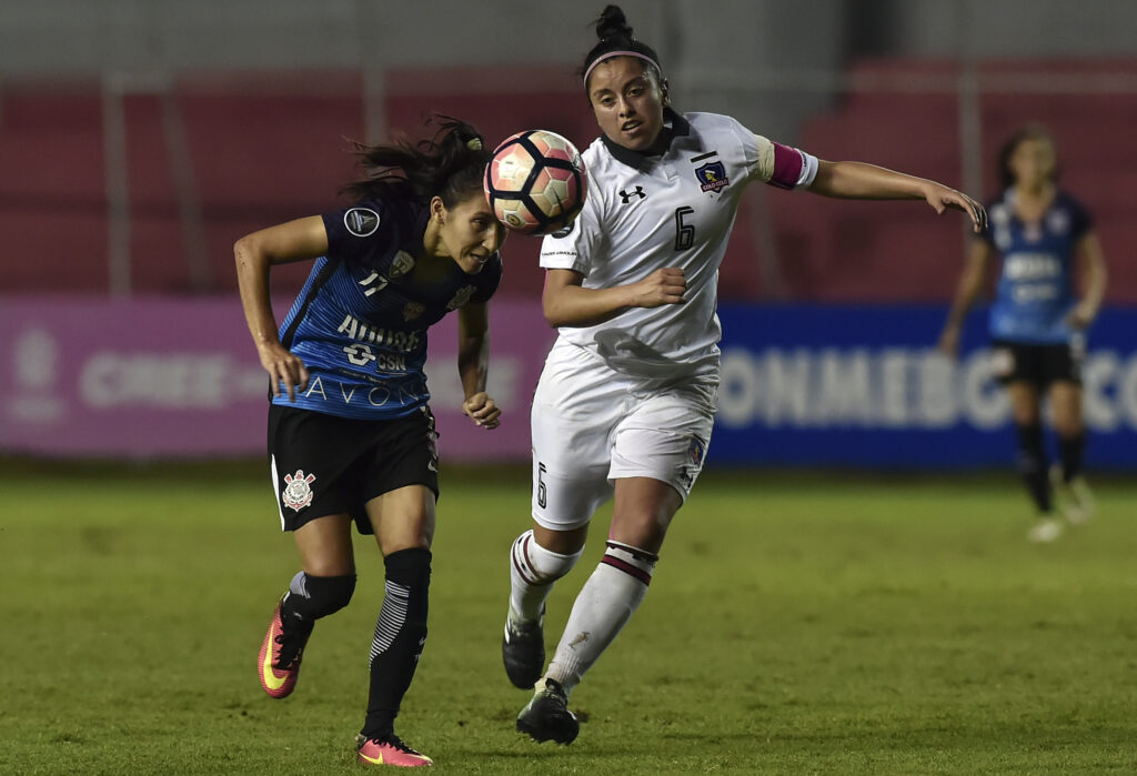 Patricia Padium (L) of Brazils Audax/Corinthians, vies for the ball with Claudia Soto of Chile's Colo Colo during the Women Copa Libertadores final match