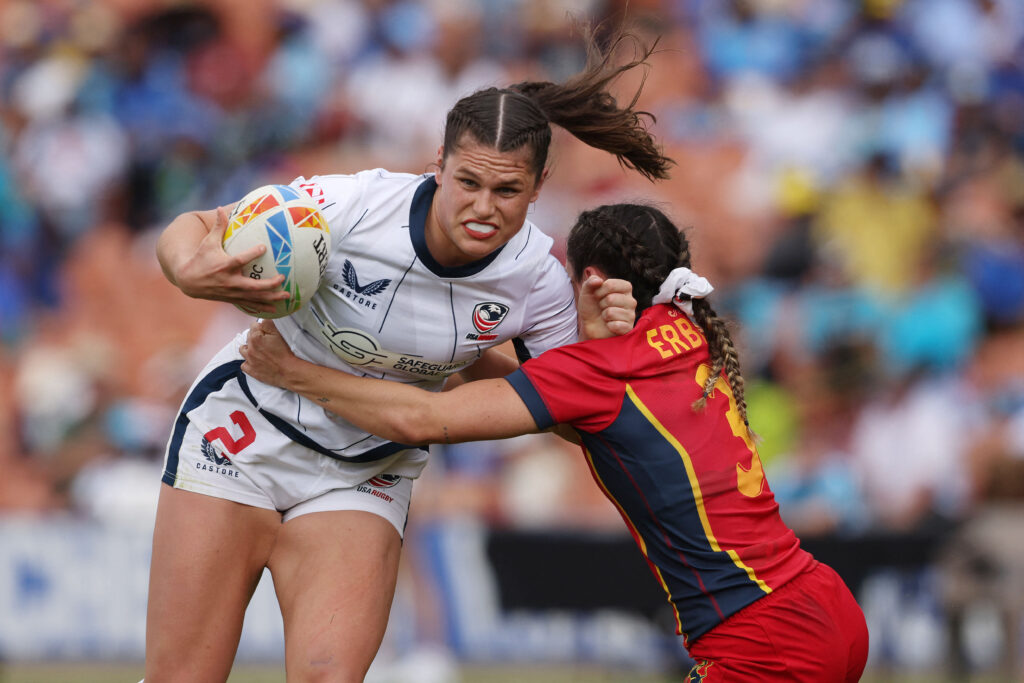 USA rugby's Ilona Maher breaks a tackle in a 2023 game.