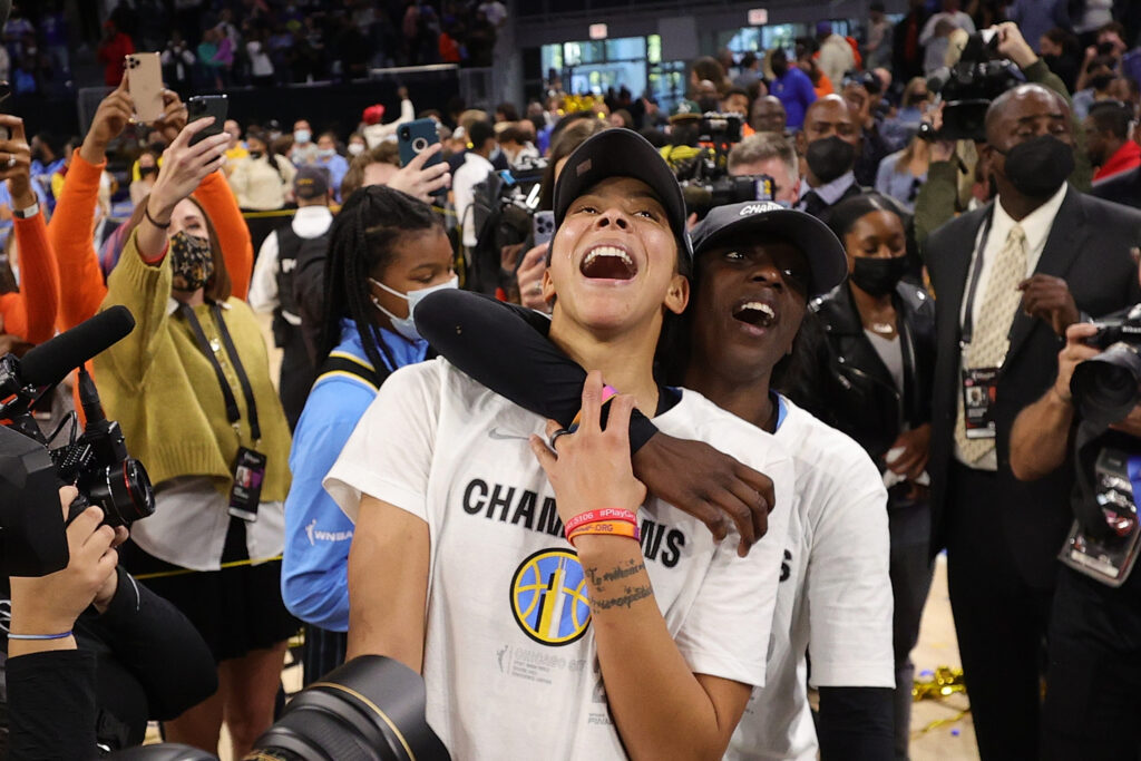 WNBA players Kahleah Copper and Candace Parker celebrating winning the 2021 championship with the Chicago Sky