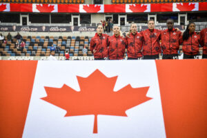 Team Canada with their flag at the 2024 Concacaf Women's Gold Cup