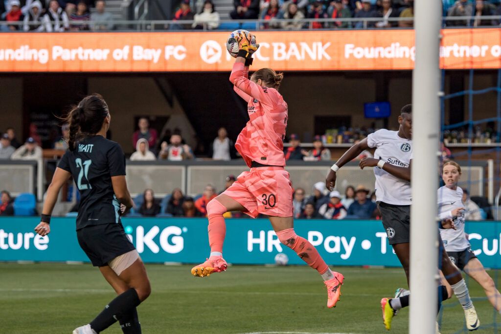 NWSL goalkeeper Ann-Katrin Berger of NJ/NY Gotham FC stops the ball during a game against Bay FC.