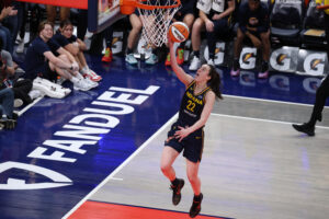 wnba rookie caitlin clark shoots on the court for the indiana fever.