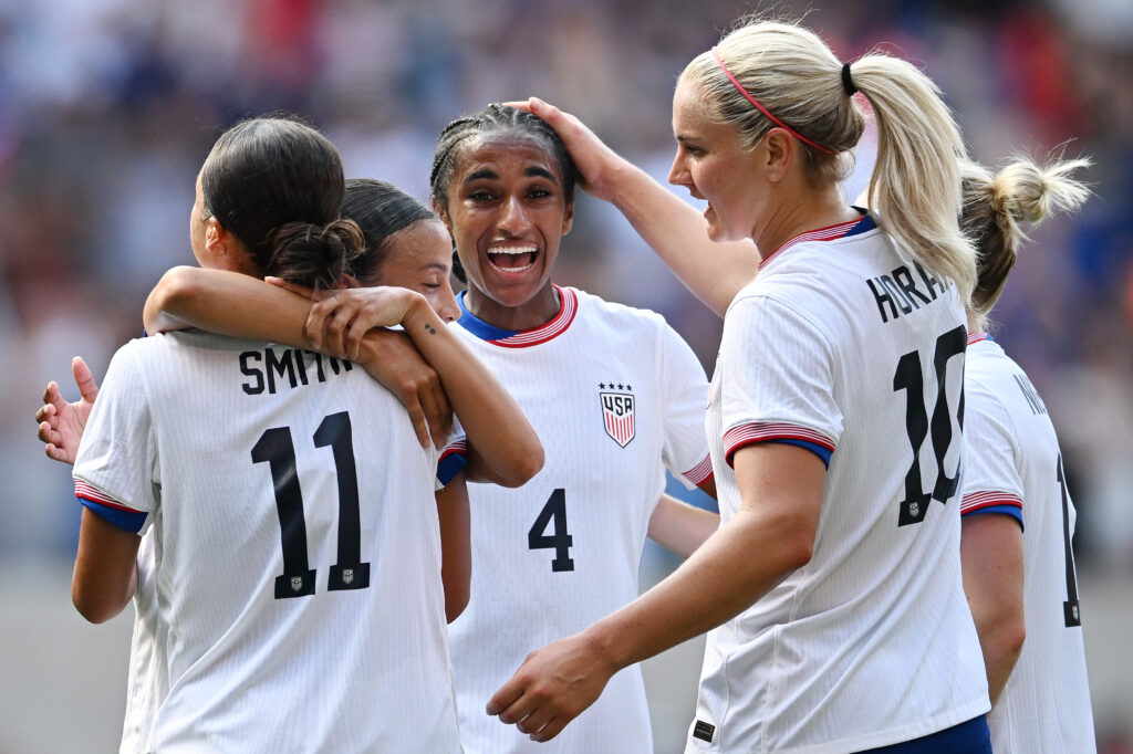 USWNT forward Sophia Smith celebrates with teammates after scoring a goal against Mexico