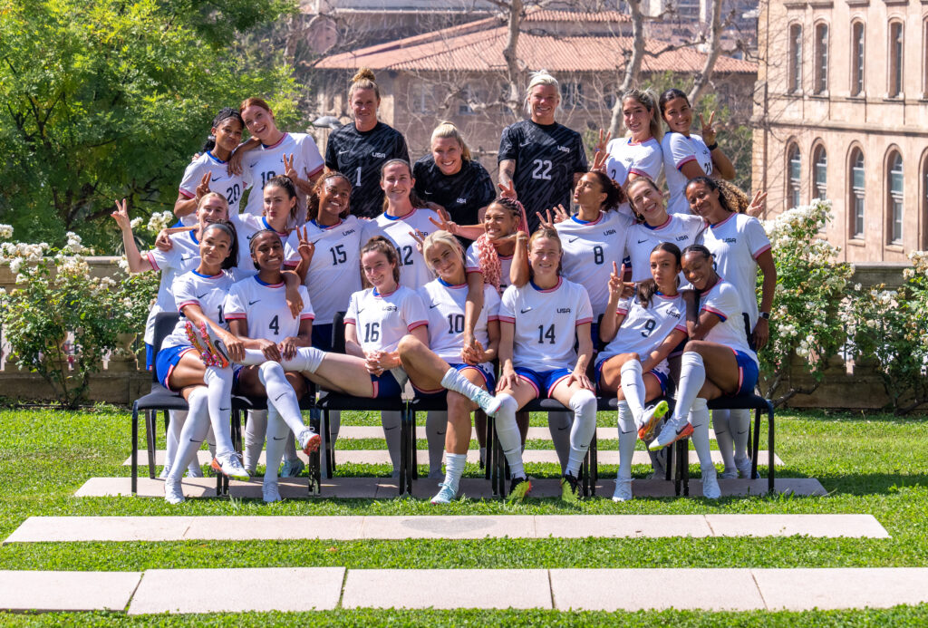 The USWNT takes a silly face photo during their team Olympic photo shoot