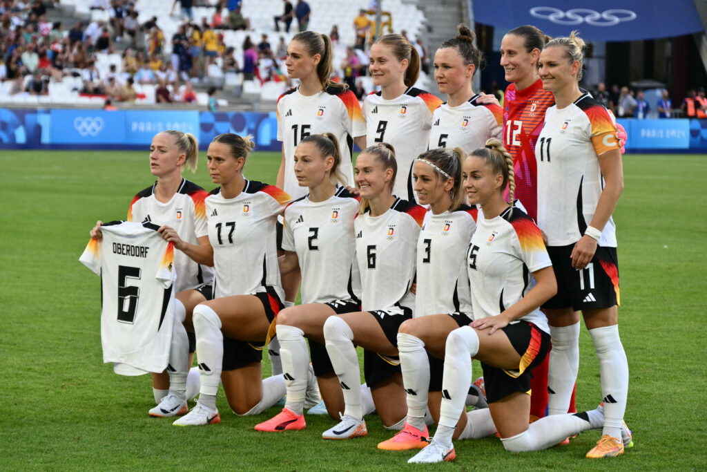 Team Germany poses before their Olympic opener against Australia