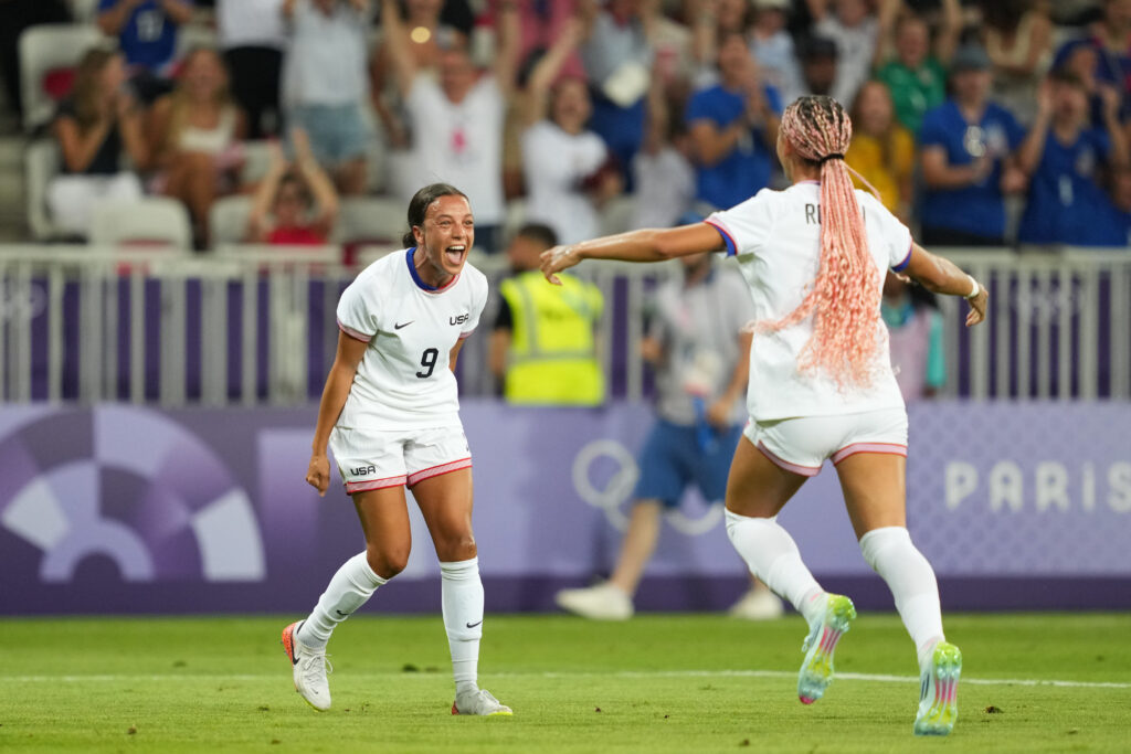 Mallory Swanson celebrates with Trinity Rodman after Rodman's opening goal in the USWNT's 3-0 win over Zambia