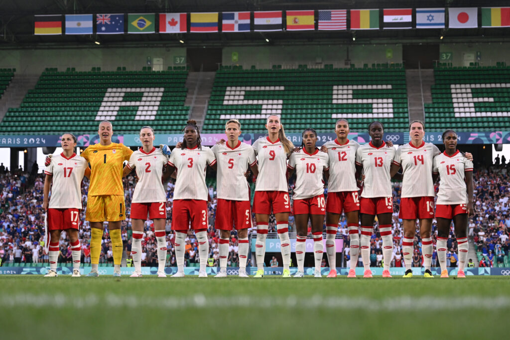 Team Canada sing their national anthem at the Olympics